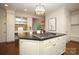 Bright kitchen boasts an island, white cabinets, and a built-in workspace at 258 Fenton Pl, Charlotte, NC 28207