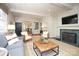 Living area with a fireplace, built-in shelving and large windows at 258 Fenton Pl, Charlotte, NC 28207