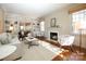 Spacious living room featuring built-in shelving and a fireplace at 258 Fenton Pl, Charlotte, NC 28207