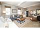 Open living room with coffered ceiling, fireplace, and ample seating at 258 Fenton Pl, Charlotte, NC 28207