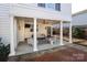 Covered patio with seating area, ceiling fan, and brick flooring at 258 Fenton Pl, Charlotte, NC 28207