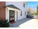 White side entrance with black door and brick wall at 258 Fenton Pl, Charlotte, NC 28207