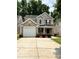 Charming two-story home featuring a one-car garage and well-maintained landscaping at 2604 Cochrane Dr, Charlotte, NC 28269