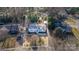 Aerial view of a charming home with mature trees, manicured landscaping, and a fenced yard at 2624 Ashley Rd, Charlotte, NC 28208