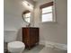 Cozy bathroom with modern vanity, sleek fixtures, and window offering natural light at 2624 Ashley Rd, Charlotte, NC 28208