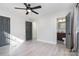 Bedroom with a ceiling fan and modern wood-look flooring that leads to the attached bath at 2624 Ashley Rd, Charlotte, NC 28208