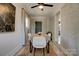 Cozy dining room features brick walls, a modern table, and a unique entryway at 2624 Ashley Rd, Charlotte, NC 28208