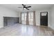 Bright living room featuring a decorative fireplace and ample natural light at 2624 Ashley Rd, Charlotte, NC 28208