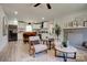 Inviting living room featuring a stone fireplace and open layout to a modern kitchen with a breakfast bar at 2624 Ashley Rd, Charlotte, NC 28208