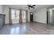 Comfortable living area featuring hardwood floors, neutral walls, and bright lighting at 2624 Ashley Rd, Charlotte, NC 28208