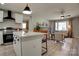 Open floorplan showcasing the kitchen with a breakfast bar flowing into the inviting living room area at 2624 Ashley Rd, Charlotte, NC 28208