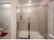 Shower with glass enclosure and tiled walls at 2748 Smethwick Ln, Gastonia, NC 28056