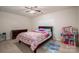 Bedroom with ceiling fan and colorful bedding at 2748 Smethwick Ln, Gastonia, NC 28056