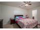 Bedroom with ceiling fan and colorful bedding at 2748 Smethwick Ln, Gastonia, NC 28056