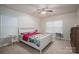 Bedroom with queen bed and ceiling fan at 2748 Smethwick Ln, Gastonia, NC 28056