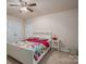 Bedroom with queen bed, nightstand, and double doors at 2748 Smethwick Ln, Gastonia, NC 28056