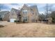 Two-story brick home with a white garage door and fenced yard at 2748 Smethwick Ln, Gastonia, NC 28056