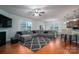 Bright living room with hardwood floors, open floor plan, and kitchen views at 2748 Smethwick Ln, Gastonia, NC 28056