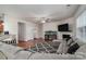 Open living room features hardwood floors and a view into the kitchen at 2748 Smethwick Ln, Gastonia, NC 28056