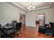 Spacious home office with hardwood floors and view of kitchen at 2748 Smethwick Ln, Gastonia, NC 28056