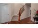 Elegant staircase with wood flooring and wrought iron railing at 2748 Smethwick Ln, Gastonia, NC 28056