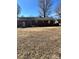 Large backyard with mature trees and brown grass at 29086 Sweet Home Church Rd, Albemarle, NC 28001