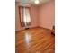 Bedroom with hardwood floors and pink walls at 29086 Sweet Home Church Rd, Albemarle, NC 28001