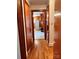 Hallway with wood floors and access to kitchen at 29086 Sweet Home Church Rd, Albemarle, NC 28001