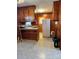 Kitchen with wood cabinets and a refrigerator at 29086 Sweet Home Church Rd, Albemarle, NC 28001