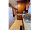 Kitchen with wood cabinets and laminate countertops at 29086 Sweet Home Church Rd, Albemarle, NC 28001