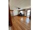 Living room with hardwood floors and large windows at 29086 Sweet Home Church Rd, Albemarle, NC 28001