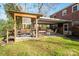 Outdoor entertainment area with pergola, seating, and grilling station at 303 Edgewood Rd, Shelby, NC 28150