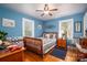 Blue bedroom with wooden bed frame and plenty of natural light at 303 Edgewood Rd, Shelby, NC 28150