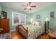 Green bedroom with floral bedding and ample closet space at 303 Edgewood Rd, Shelby, NC 28150