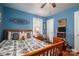 Blue bedroom with a wooden bed frame and a comfy atmosphere at 303 Edgewood Rd, Shelby, NC 28150