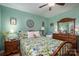 Green bedroom with floral bedding and wooden dresser at 303 Edgewood Rd, Shelby, NC 28150