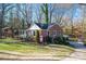 Brick house with a driveway and a spacious yard at 303 Edgewood Rd, Shelby, NC 28150