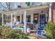 Inviting front porch with rocking chairs and decor at 303 Edgewood Rd, Shelby, NC 28150