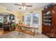 Eat-in kitchen with farmhouse table and wooden cabinetry at 303 Edgewood Rd, Shelby, NC 28150