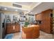 Bright kitchen with island, wood cabinets, and stainless steel appliances at 303 Edgewood Rd, Shelby, NC 28150