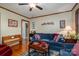 Relaxing living room with blue sofa and hardwood floors at 303 Edgewood Rd, Shelby, NC 28150