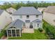 Aerial view showing house, screened porch, and backyard at 3205 Helmsley Ct, Concord, NC 28027