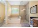 Relaxing bathroom featuring a large garden tub and separate shower at 3205 Helmsley Ct, Concord, NC 28027