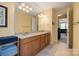 Double vanity bathroom with granite countertops and a large mirror at 3205 Helmsley Ct, Concord, NC 28027