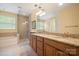 Elegant bathroom with granite countertops, soaking tub and walk-in shower at 3205 Helmsley Ct, Concord, NC 28027