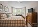 Spacious bedroom with bay window and wooden dresser at 3205 Helmsley Ct, Concord, NC 28027