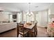 Bright dining room with hardwood floors and a chandelier at 3205 Helmsley Ct, Concord, NC 28027