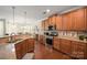 Updated kitchen featuring stainless steel appliances and wood cabinetry at 3205 Helmsley Ct, Concord, NC 28027