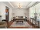 Living room with hardwood floors, a neutral sofa, and a coffee table at 3205 Helmsley Ct, Concord, NC 28027