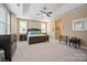 Main bedroom with a king-size bed and access to bathroom at 3205 Helmsley Ct, Concord, NC 28027